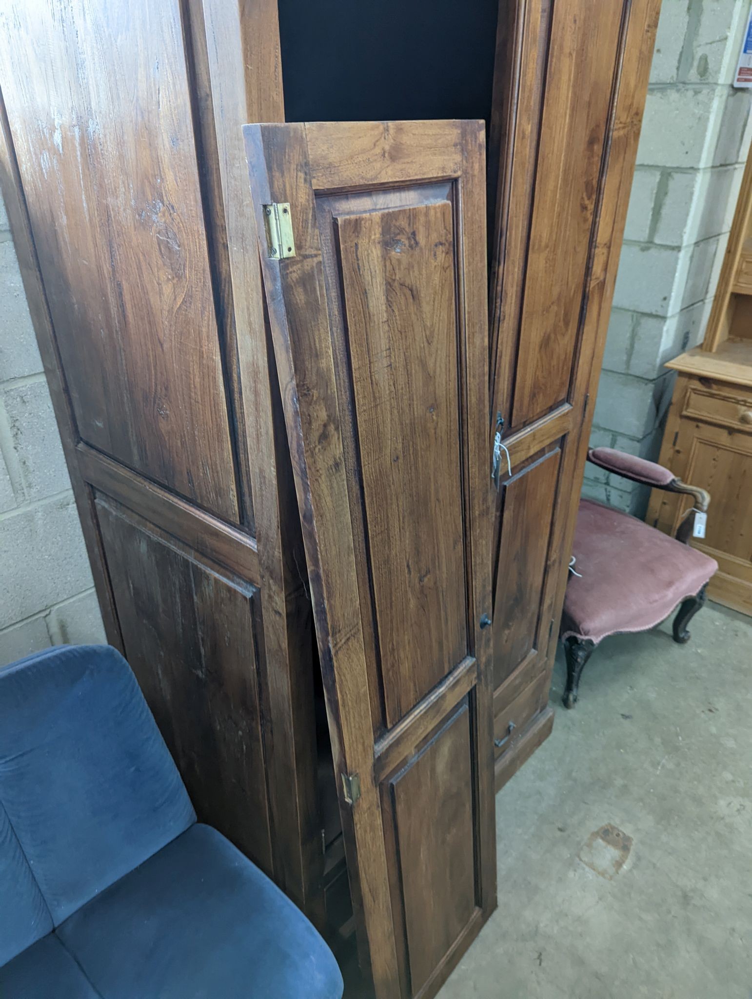 An Indonesian hardwood 2 door wardrobe (damaged), length 100cm, depth 66cm, height 200cm